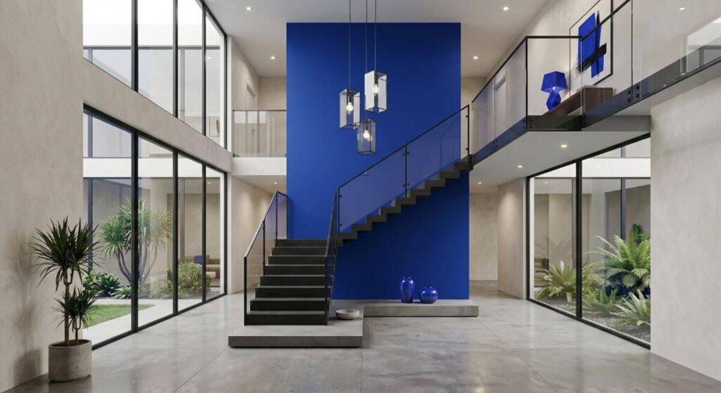 Nowoczesne ciemne schody wyeksponowane na tle intensywnie niebieskiej ściany