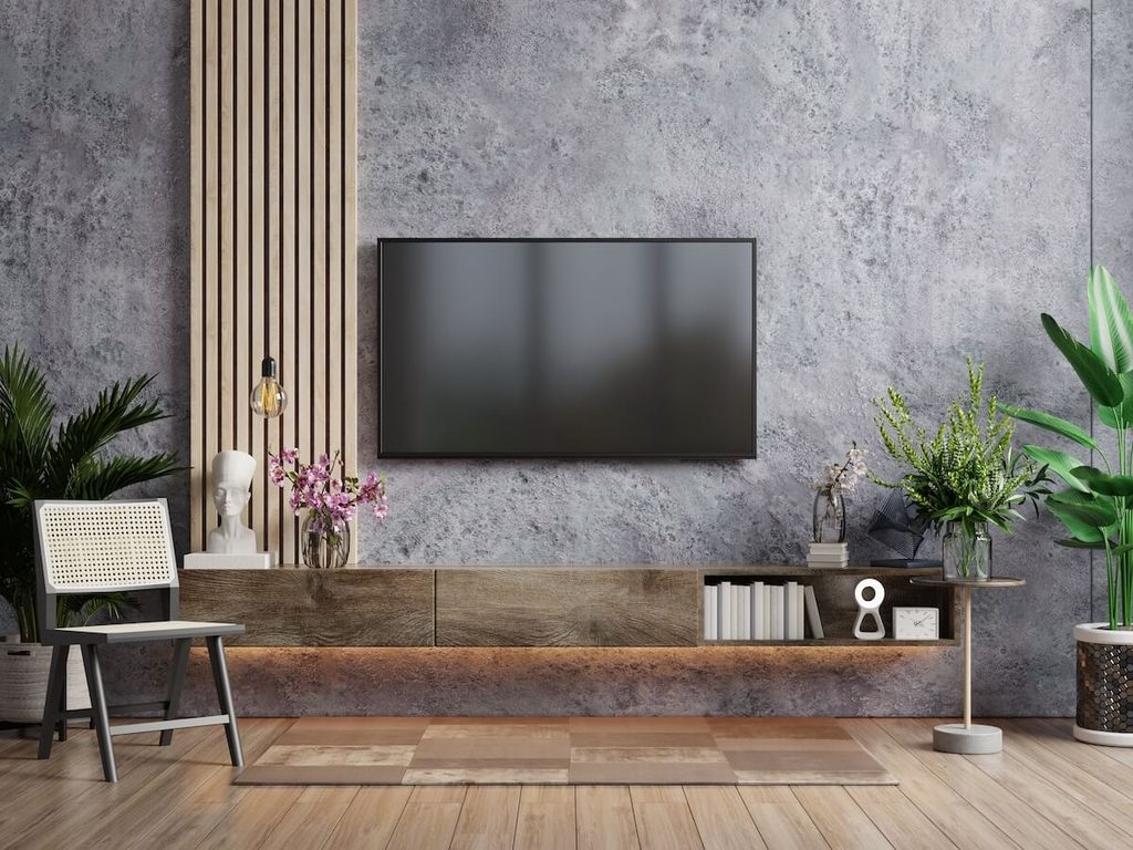 Nowoczesna ściana telewizyjna w salonie z betonem architektownicznym Beton architektoniczny w projekcie ścianki TV